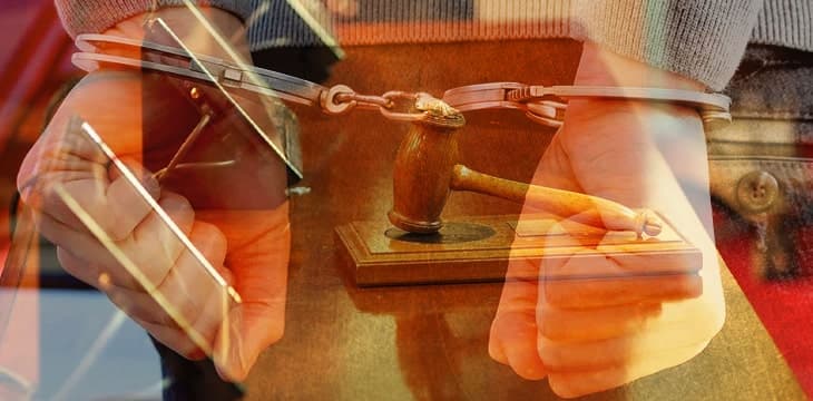 Man with handcuffs overlay on judge's gavel